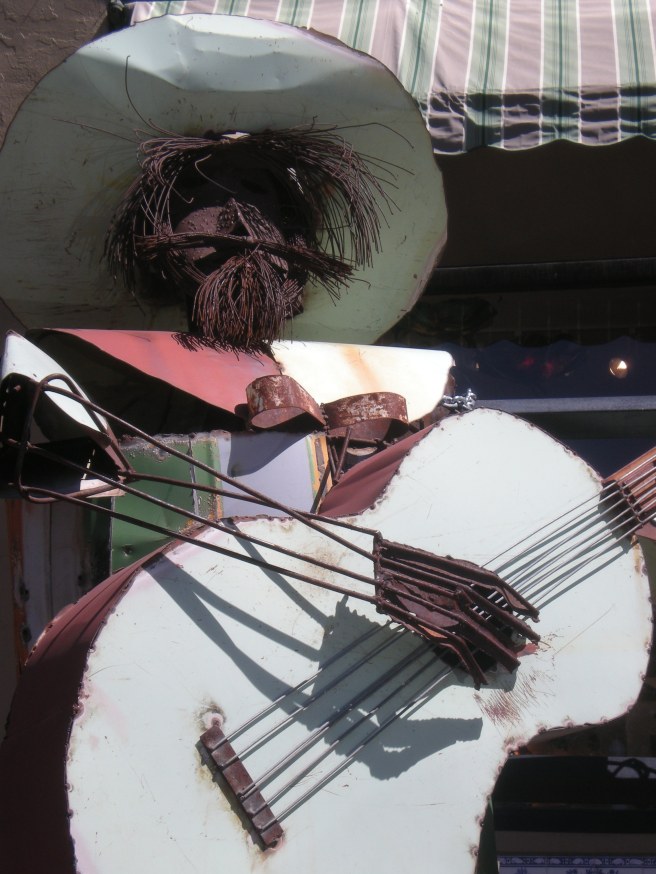 Madrid, NM: A Ghost Town Reborn - Guitarist Outside Jezebel's